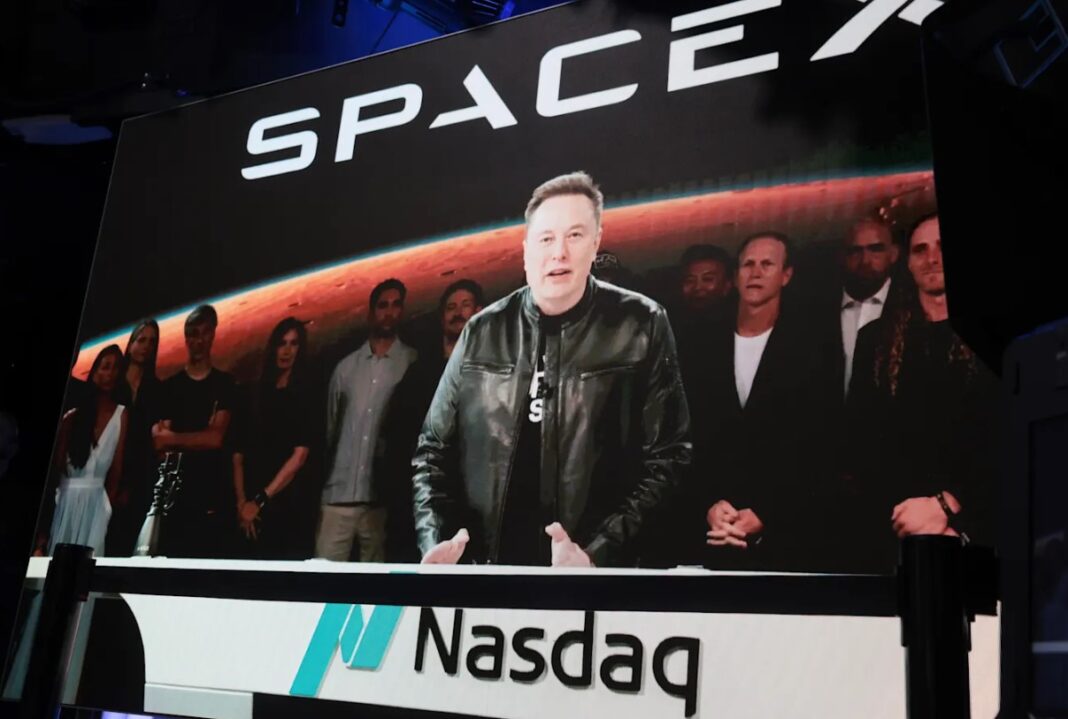 1.Elon Musk speaks via video before the ringing of the NASDAQ opening bell on Friday. Getty Images_9news Elon Musk speaks via video before the ringing of the NASDAQ opening bell on Friday. Getty Images_9news