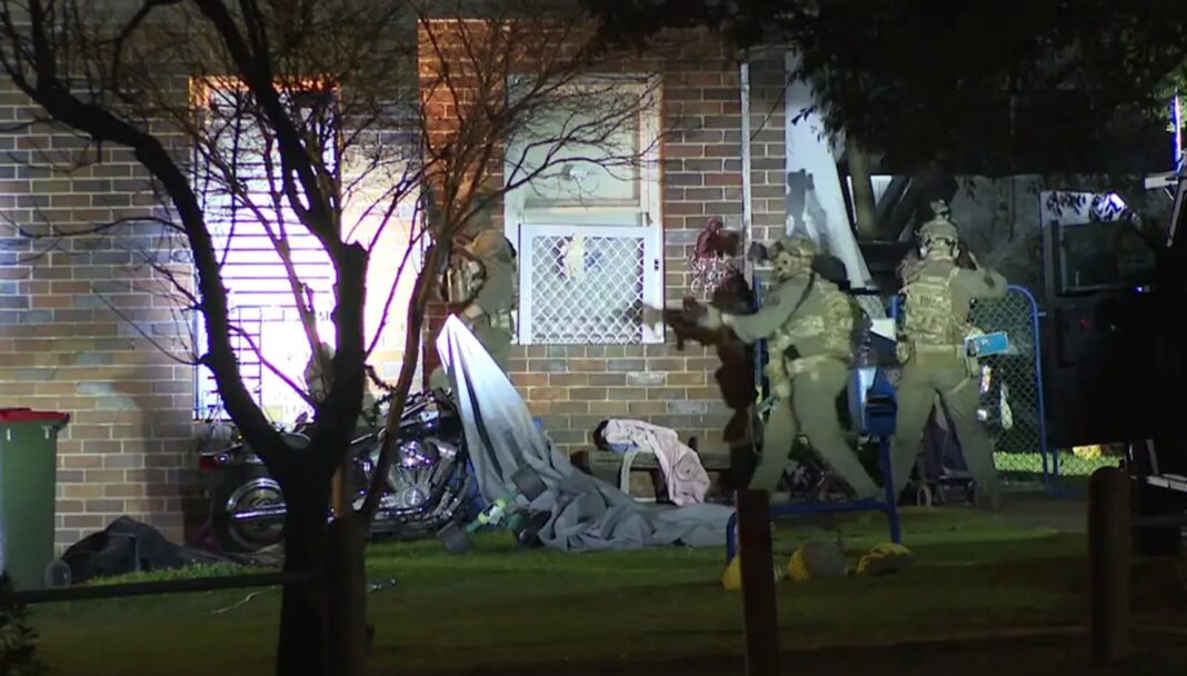 Heavily armed police swarmed the building with helicopters circling above. Supplied._9NEWS